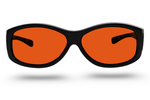 Gafas de protección dental con filtro naranja para proteger la vista durante tratamientos odontológicos en Madrid